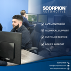 Person working at a computer with Scorpion Automotive branding and services listed.
